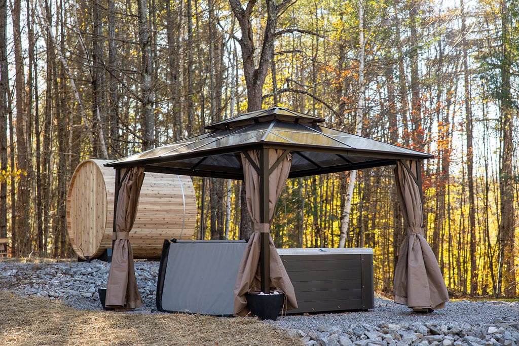 Private hot tub and barrel sauna under the trees